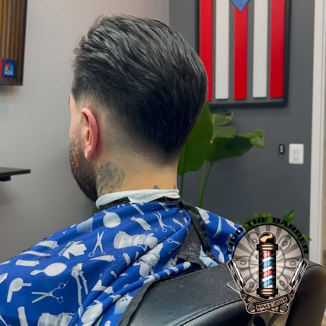 Back view of combed-back hair with a clean tapered neckline